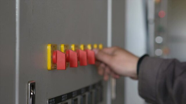 Person adjusts the sensors on the device. Worker turns the levers of the sensors. Professional equipment. Close-up.