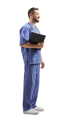 Male healthcare worker with a clipboard