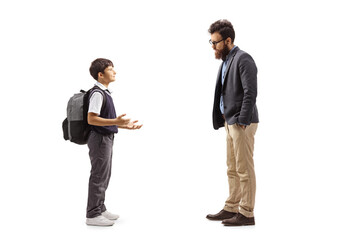Schoolboy with backpack talking to a bearded man