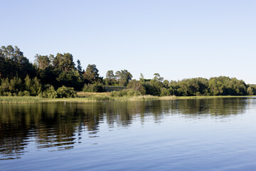 Fototapeta na wymiar Ladoga Lake with Stone Embankment in Sortavala