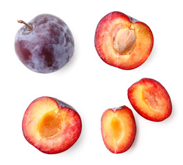 Set of plums whole, half and piece on a white background, isolated. Top view