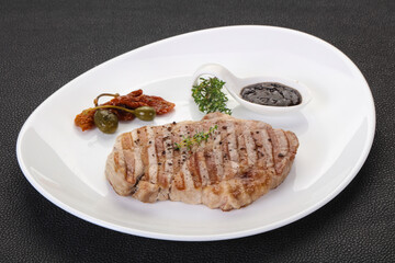 Grilled pork steak with pepper sauce