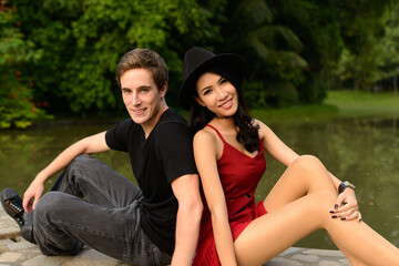 Portrait of multi ethnic couple together and in love at the park