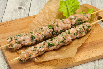 Raw minced pork skewer kebab for grill