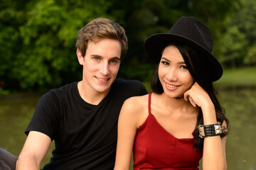 Fototapeta premium Portrait of multi ethnic couple together and in love at the park