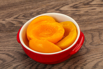 Marinated peaches fruit in the bowl