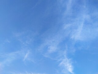 Cottony white clouds in blue sky