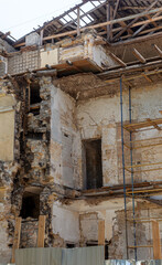 Fototapeta na wymiar As result of violation of building codes during reconstruction of an old historic building, house collapsed. Violation of technology of repair and restoration of old building led to its collapse