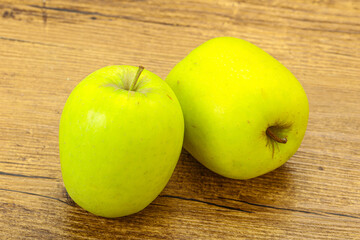 Two ripe green sweet apples