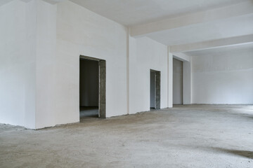 Unfinished building interior, white room.Repairs in the apartment. Preparing in the commercial object