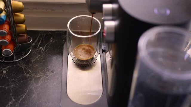 Espresso coffee being made in kitchen