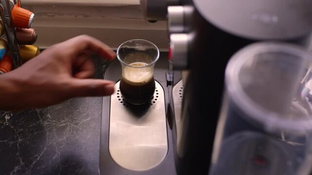 Espresso coffee being made in kitchen
