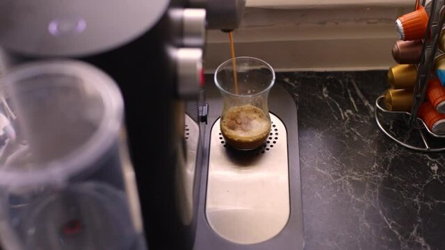 Espresso coffee being made in kitchen