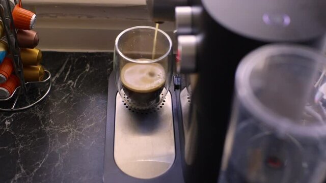Espresso coffee being made in kitchen