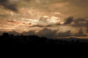 sunset in a part of the city, orange clouds