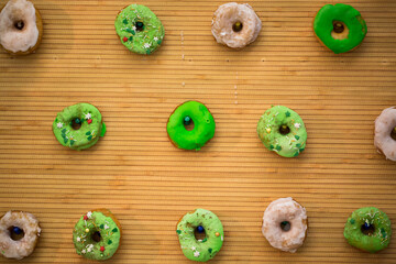 Glazed donuts on wooden background