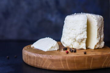 cheese head and slices soft pickled Menu camembert brie serving size. food background top view copy space organic healthy eating keto or paleo diet