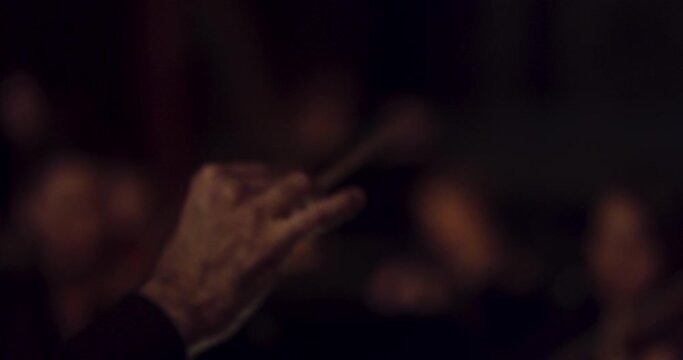 conductor's arm symphony orchestra