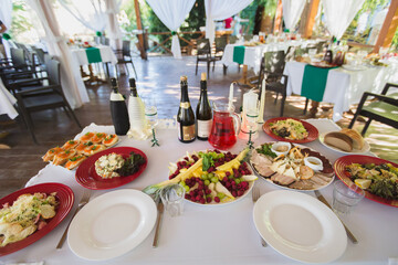 Banquet wedding table setting on evening reception waiting guests