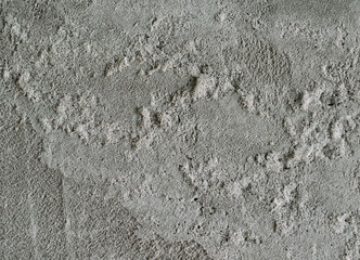 ?oncrete texture part of the wall with unevenly applied structure (with hills and protrusions). Big plan as background with possible inscriptions and text