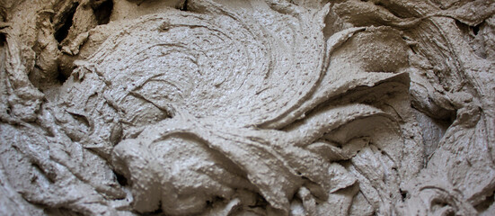 Gypsum plaster in a bucket, prepared for application on the wall. Beautiful texture.