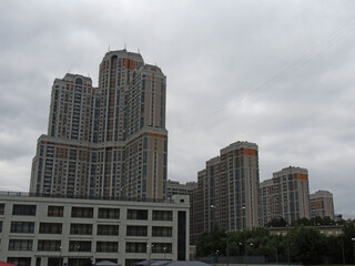 Fototapeta na wymiar elements of multi-storey residential buildings in the background sky.