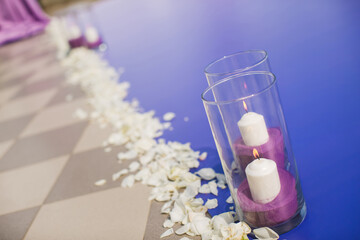 Wedding arch of purple color on the background of the sea.