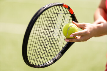 Close up of a tennis player hitting the ball with racket