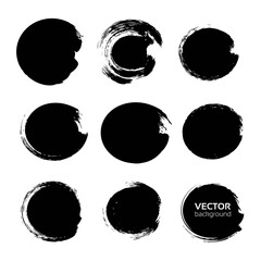 Black circles set from abstract smears on a white background