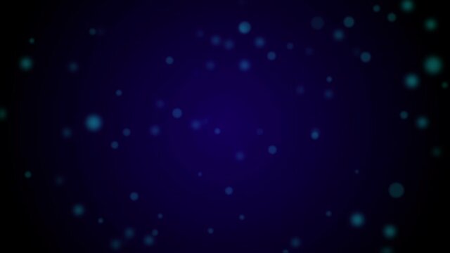 Blurred particles floating up against a dark blue background.