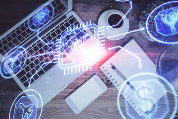 Multi exposure of data theme drawing hologram over topview work desk background with computer. Concept of technology.