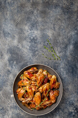 Roasted chicken wings in sweet sauce. Top view copy space