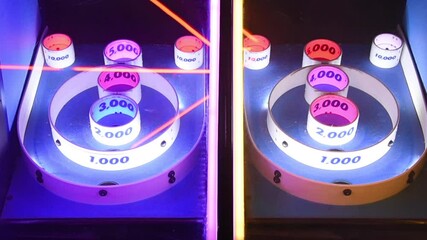 Ball tossing arcade game with flashing lights