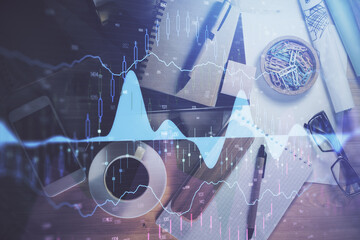 Double exposure of forex graph drawing and work table top veiw. Concept of financial analysis.