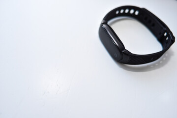 Sports black shoes and watches for monitoring your health on a white background