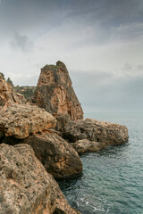 Fototapeta na wymiar Cliffs of cliffs by the sea