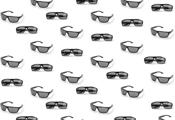 colorful pattern of sunglasses on a white background top view
