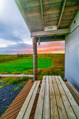 Wooden home in the Iceland countryside at summer sunset