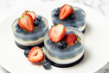 Mini blueberry fruit agar agar or jelly cake decorated with strawberry