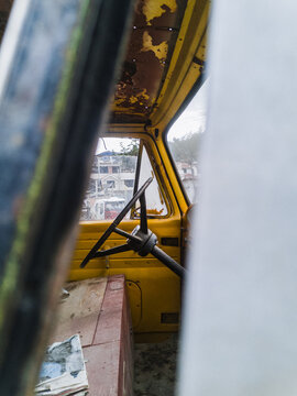 Rudder of car abandoned by a window