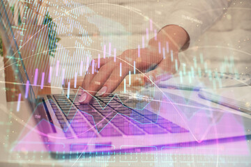 Multi exposure of woman hands typing on computer and forex chart hologram drawing. Stock market analysis concept.