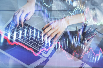 Double exposure of woman hands typing on computer and forex chart hologram drawing. Stock market invest concept.