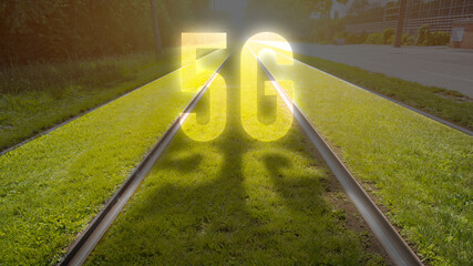 5G sign on tram rails background of the city. Concept of 5G network, high-speed mobile Internet, new generation networks. Creative background with sunlight effect
