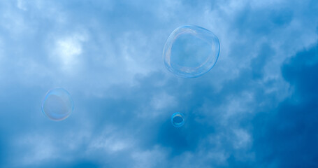 soap bubble against the background of a stormy dark blue sky