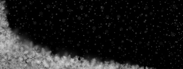 Christmas background of snowflakes of different shapes, sizes, blur and transparency on black background