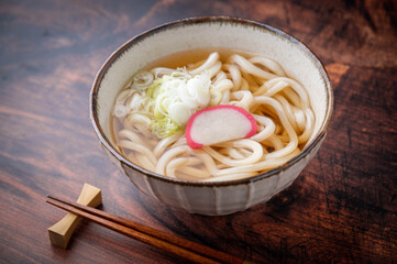 udon noodle soup with green onion and kamaboko