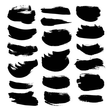 Textured black paint strokes isolated on a white background