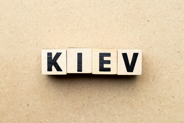 Letter block in word Kiev on wood background