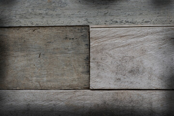 The brown wood floor sees the seam between the wood panels.