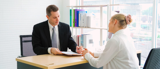 Job seeker in job interview meeting with manager and interviewer at corporate office. The young...